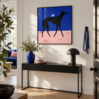 Abstract Black Dog Poster, framed on the wall of a bright modern hallway with a white wall
