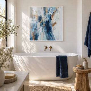 Abstract Blue Wall Art, framed on the wall of a bright bathroom with white walls