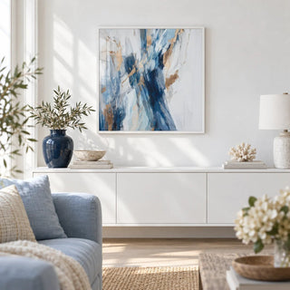 Abstract Blue Wall Art, framed on the wall of a bright coastal-modern living room with a white wall and a pale oak floor