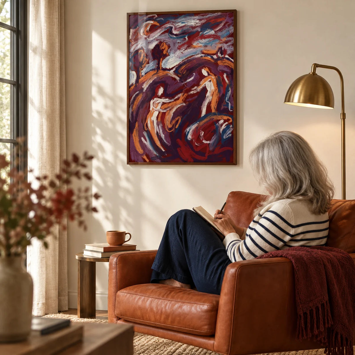 Abstract Couple Art Print, framed on the wall of a reading corner with a cream wall in a living room