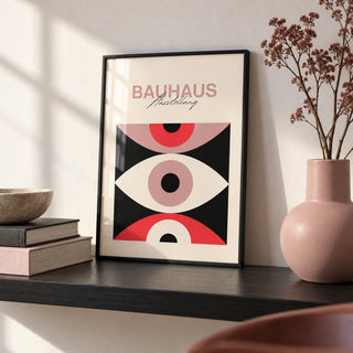 Abstract Eye Poster, a small A4 framed print leaning on a black shelf in a living room