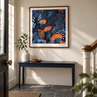 Abstract Floral Art, framed on the wall of a characterful entrance hallway in a renovated UK terrace with a warm white plaster wall and plain slate flooring