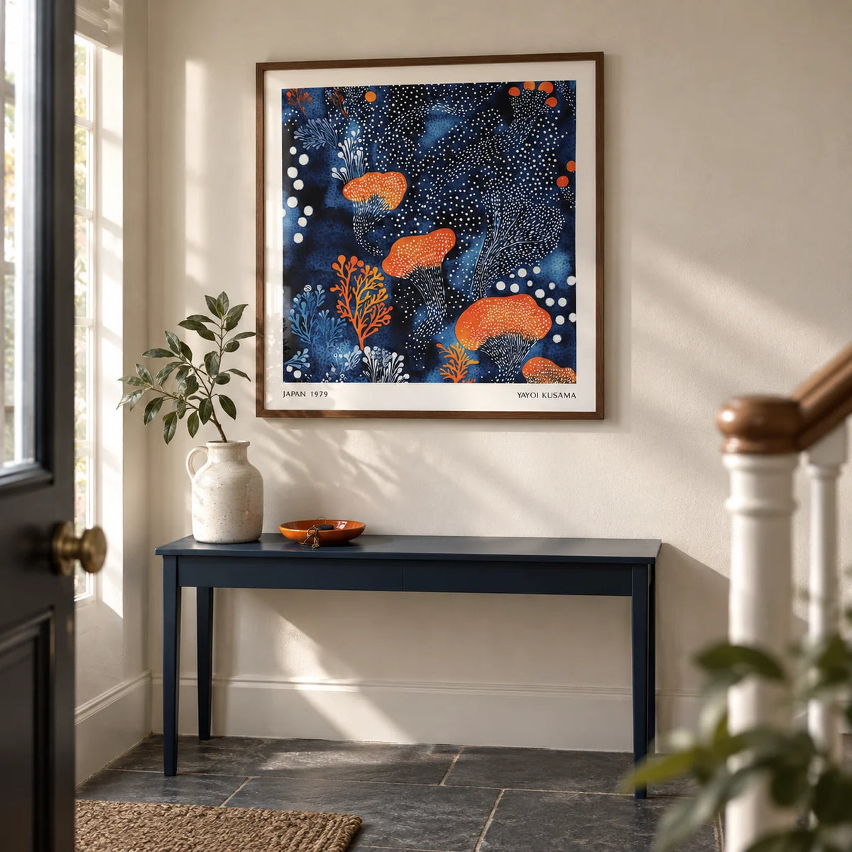 Abstract Floral Art, framed on the wall of a characterful entrance hallway in a renovated UK terrace with a warm white plaster wall and plain slate flooring