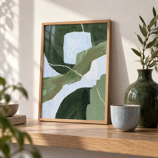 Abstract Green Wall Art, a small A4 framed print leaning on an oak shelf in a living room