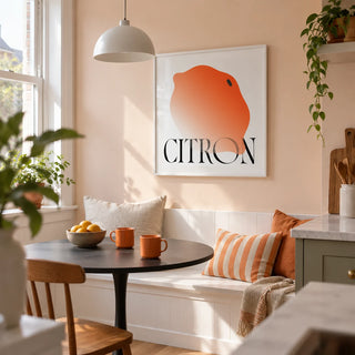 Abstract Lemon Art Print, framed on the wall of a compact kitchen breakfast nook in a renovated UK terrace with a pale peach wall and a built-in white bench