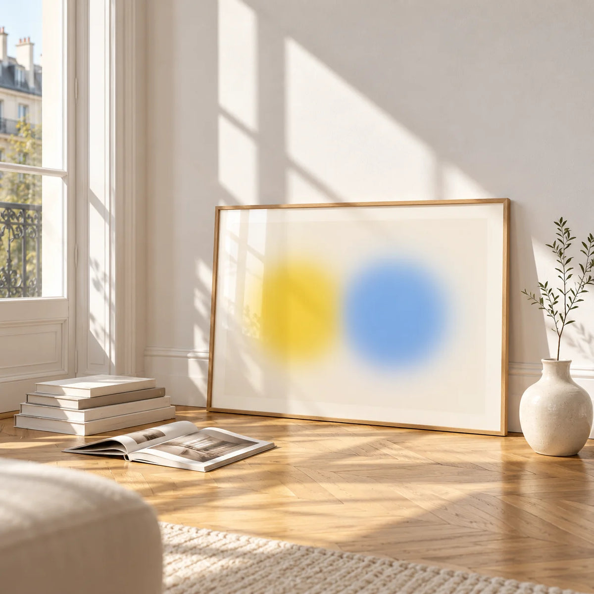 Abstract Minimal Print, framed and leaning on the parquet floor of a bright living room