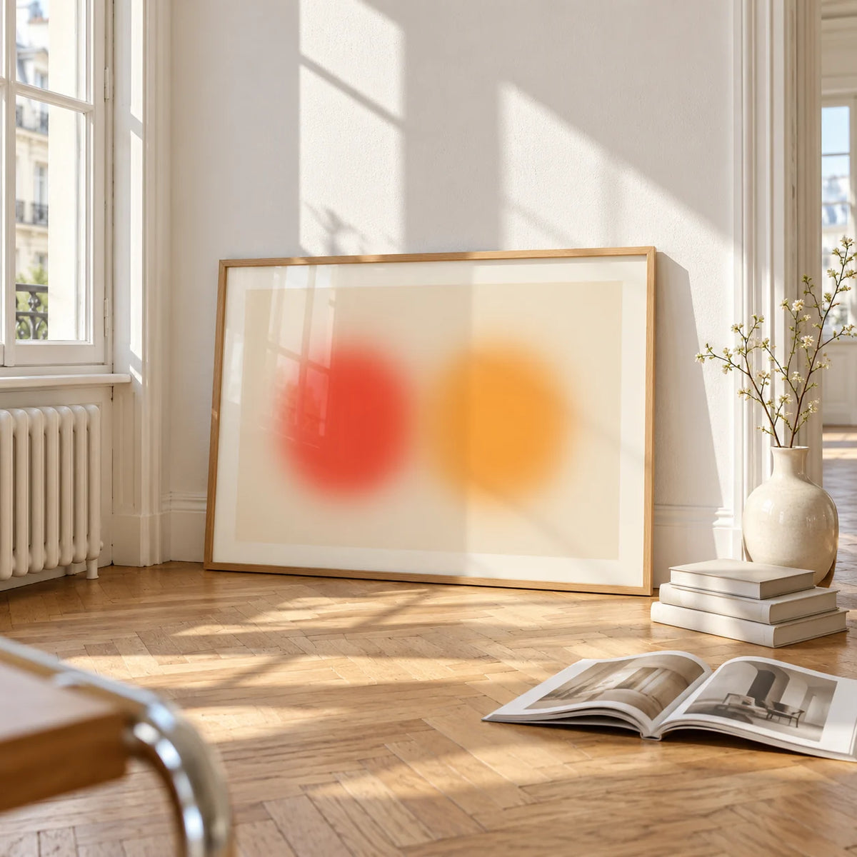 Abstract Sun Wall Art, framed and leaning on the parquet floor of a bright living room