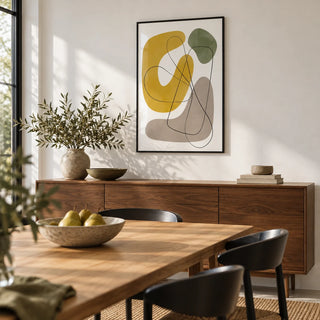 Abstract Wall Print, framed on the wall of a modern dining room with a white wall