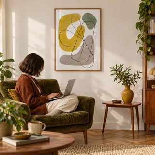 Abstract Wall Print, framed on the wall of a warm mid-century living room with a soft white wall and a herringbone oak floor