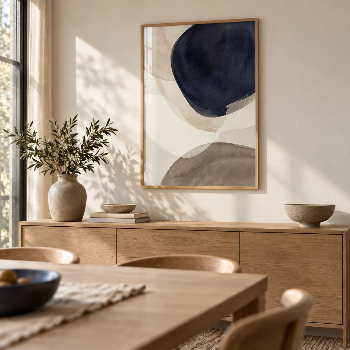 Abstract Watercolor Print, framed on the wall of a calm dining room with a warm white wall