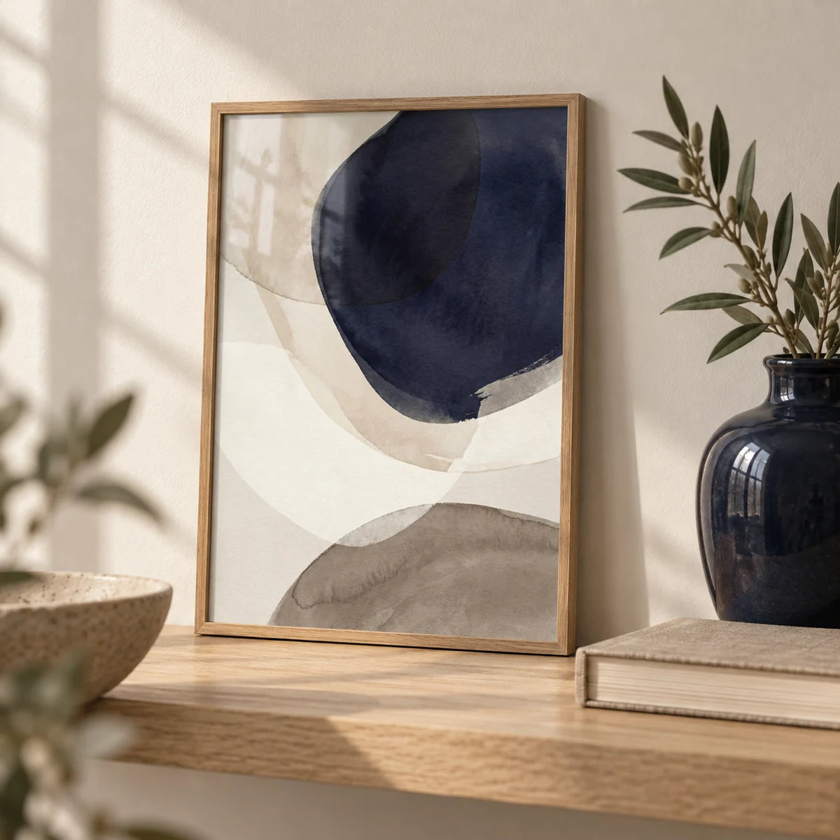 Abstract Watercolor Print, a small A4 framed print leaning on a pale oak shelf in a living room