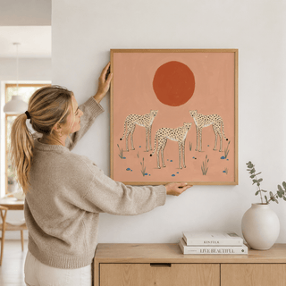 Graphic safari animal print featuring cheetahs, stones, and grass tufts