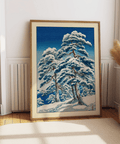 Blue-and-white winter landscape wall art showing snow-laden pines under a clear sky