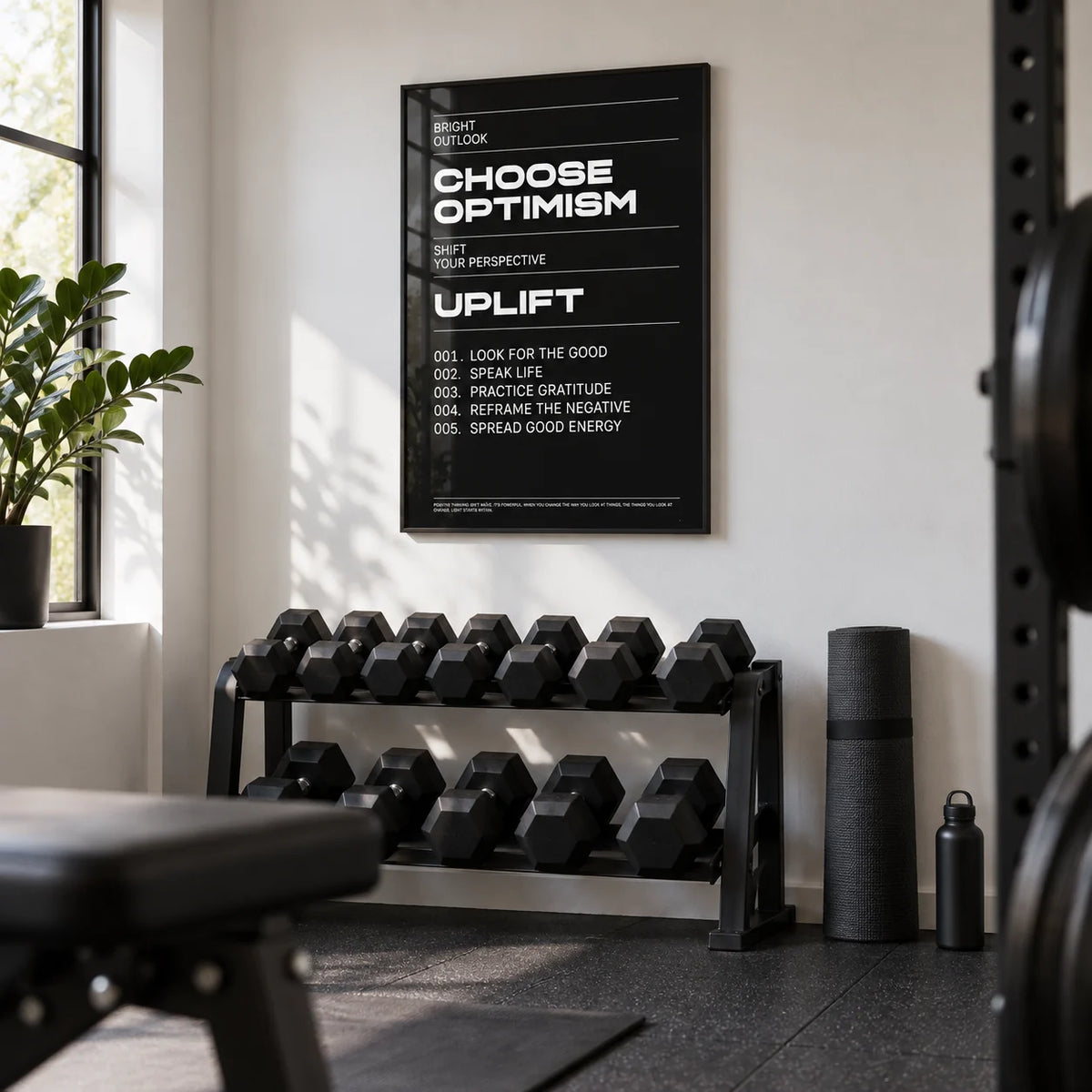 Affirmation Print, framed on the wall of a modern home gym in a converted spare room with a white wall and black rubber flooring