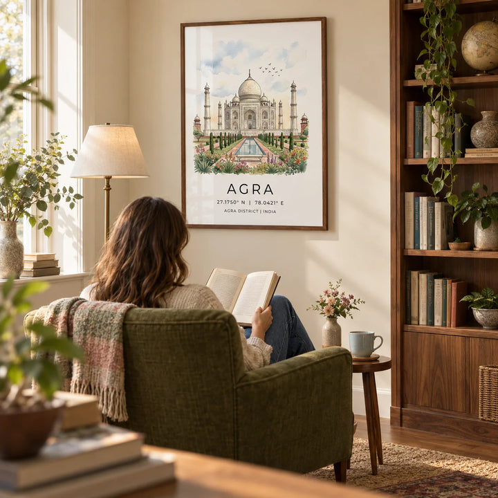 Agra Historical Poster, framed on the wall of a quiet reading room in a travel-loving couple's UK home with warm ivory walls and a built-in walnut bookcase along the adjacent wall in a living room
