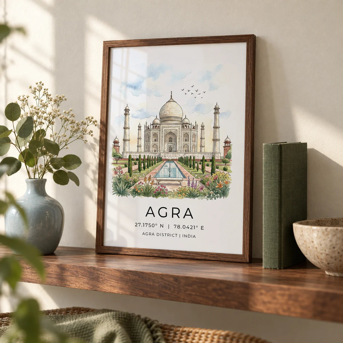 Agra Historical Poster, a small A4 framed print leaning on a walnut shelf in a living room