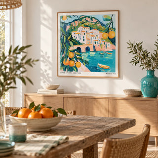 Amalfi Coast Painting, framed on the wall of a bright dining room with a soft white wall