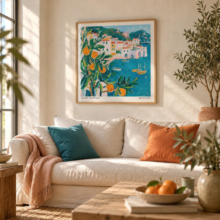 Amalfi Coast Print, framed on the wall of a relaxed living room with a warm white limewashed wall