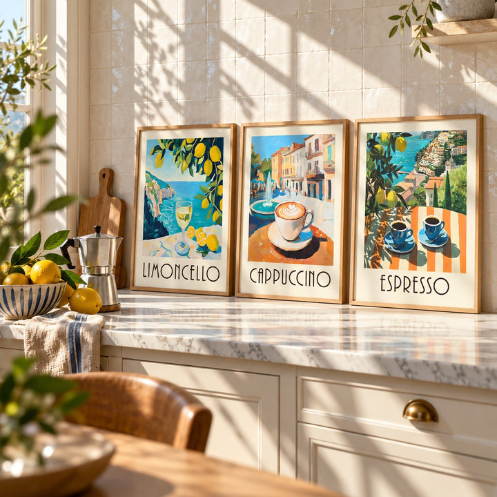 Amalfi Coast Prints Set of 3 styled on a marble kitchen worktop against white zellige tiles: Amalfi Limoncello, Morning Piazza and Amalfi Espresso shown framed side by side (frames not included)