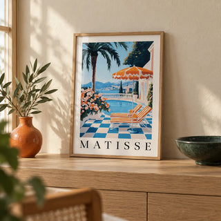 Amalfi Coast Wall Art Print, a small A4 framed print leaning on a pale oak side table in a hallway