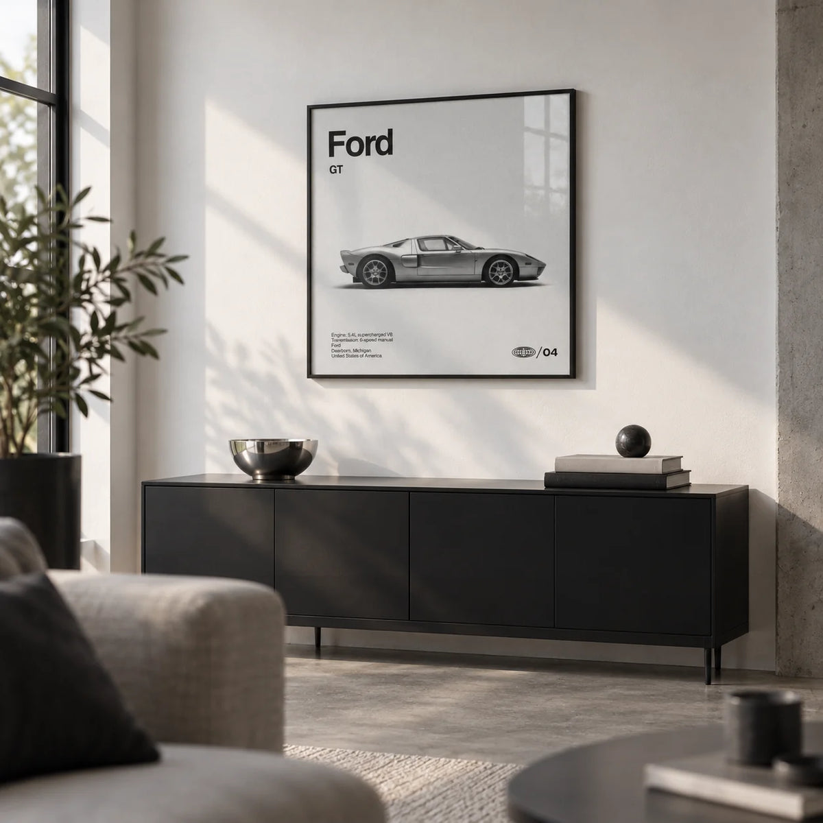 American Supercar Poster, framed on the wall of a design-led city flat living room with a white wall and a concrete floor