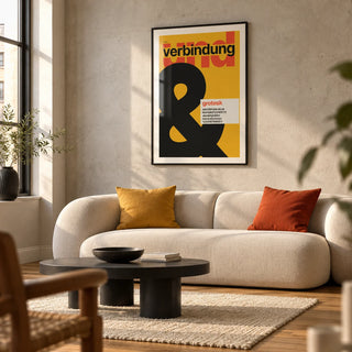 Ampersand Print, framed on the wall of a modern living room in a converted UK flat with a pale concrete wall and warm timber floor