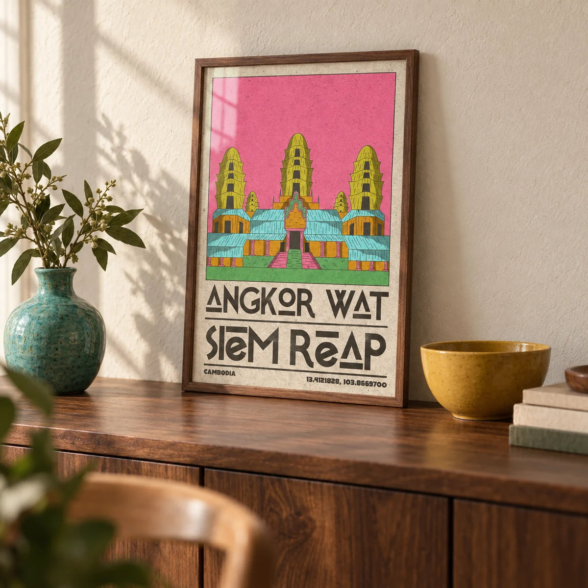 Angkor Wat Art, a small A4 framed print leaning on a walnut sideboard in a living room