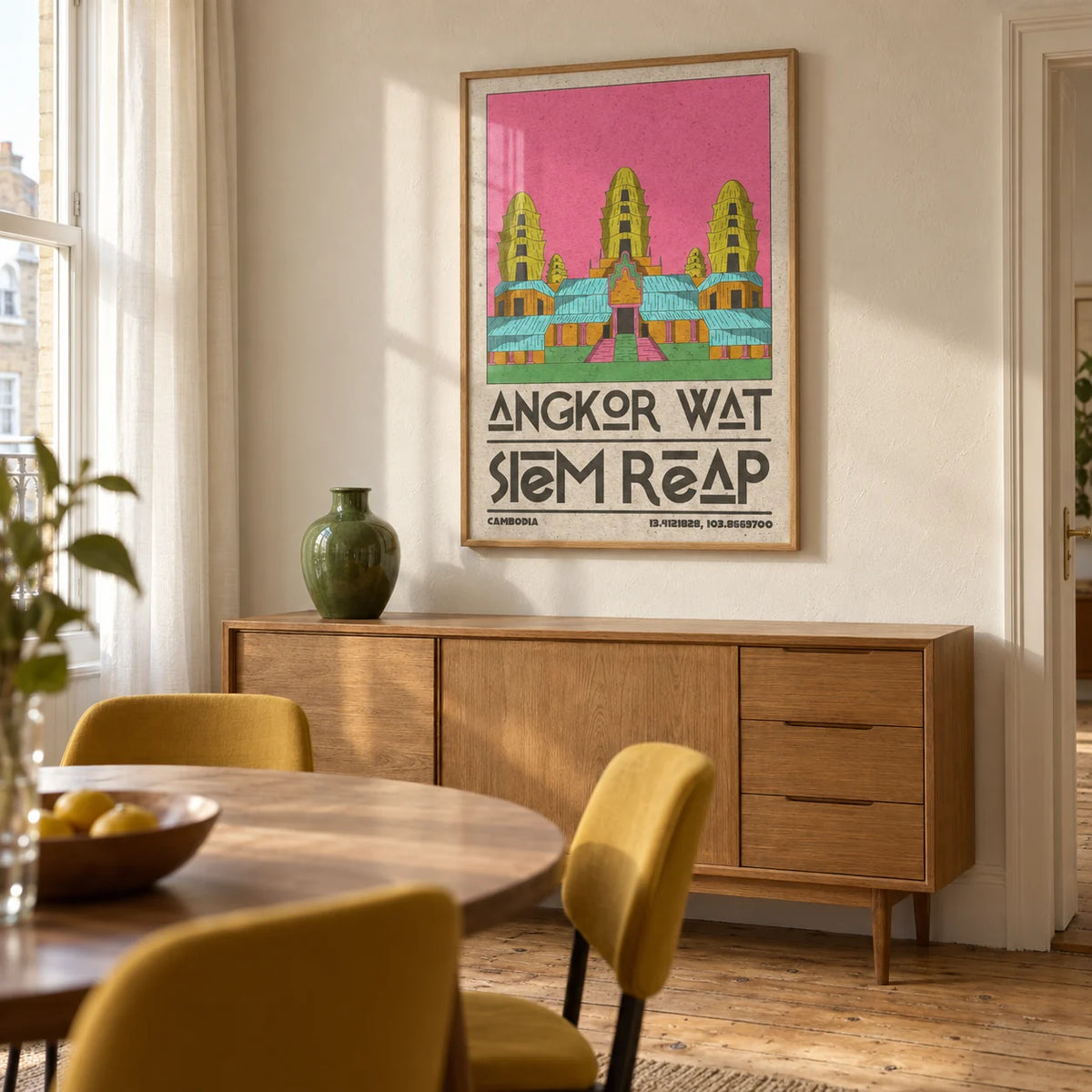Angkor Wat Art, framed on the wall of a warm dining room in a UK city flat with cream plaster walls and a stripped timber floor