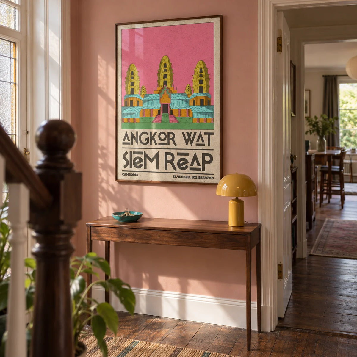 Angkor Wat Art, framed on the wall of a welcoming hallway in an Edwardian terrace with a muted dusty pink wall and original timber floorboards