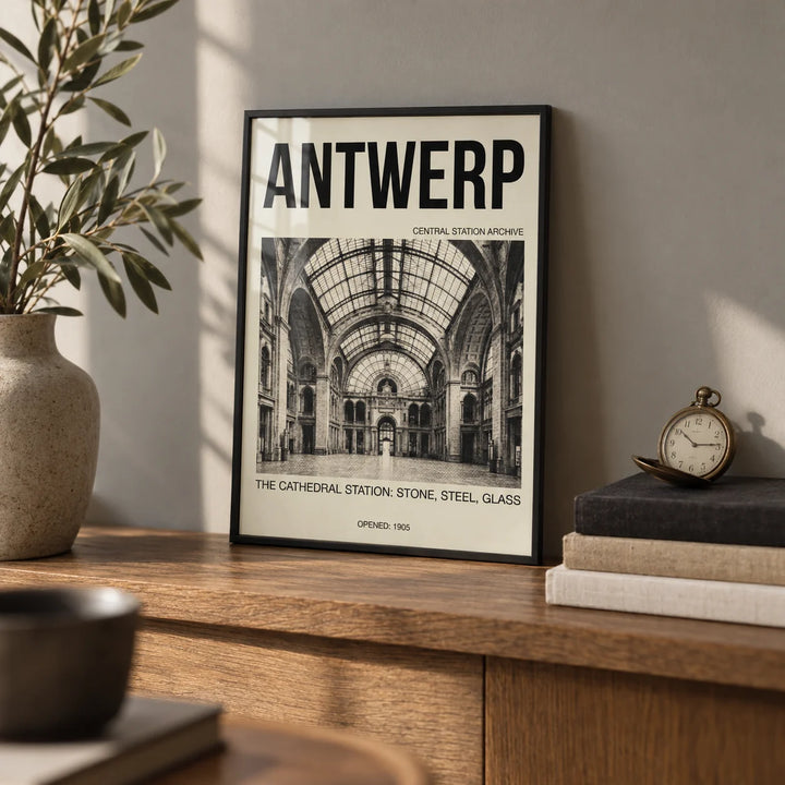 Antwerp Central Station Art Print, a small A4 framed print leaning on an oak shelf in a living room