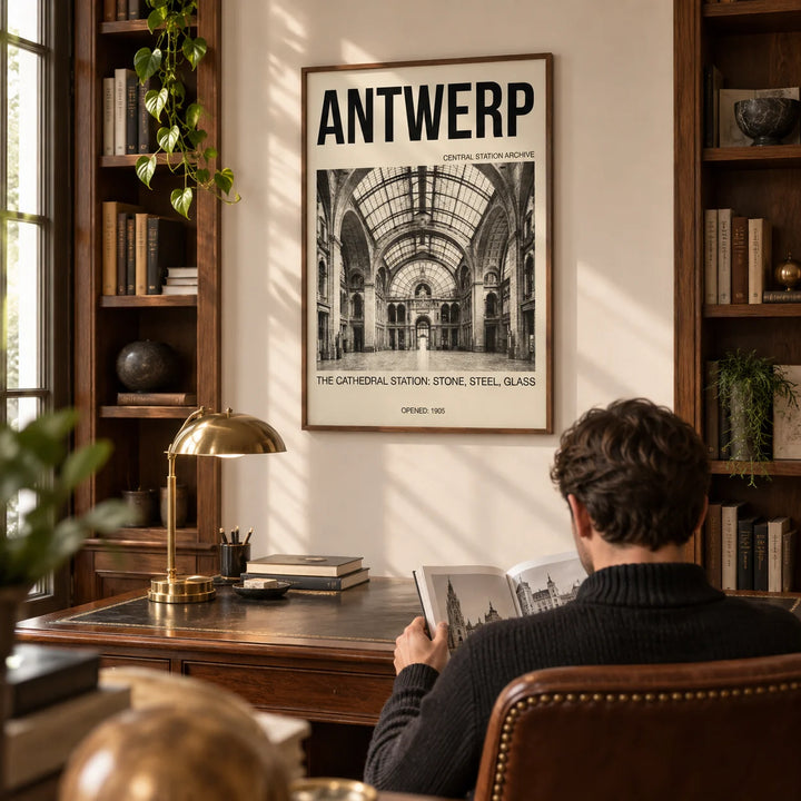 Antwerp Central Station Art Print, framed on the wall of a warm study with walnut bookshelves