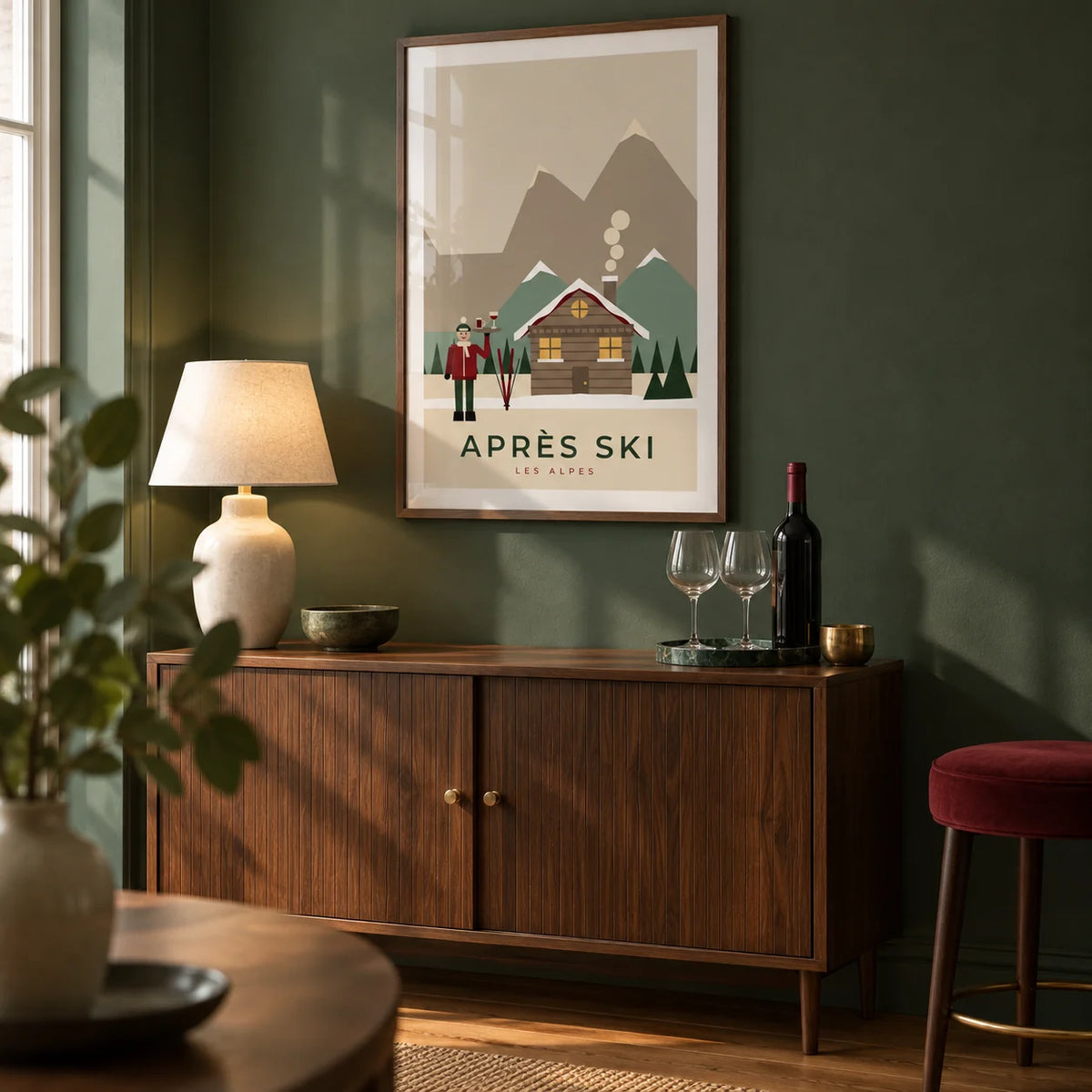 Apres Ski Poster, framed on the wall of a compact home bar corner in a UK flat with a muted forest green wall and warm oak flooring in a living room