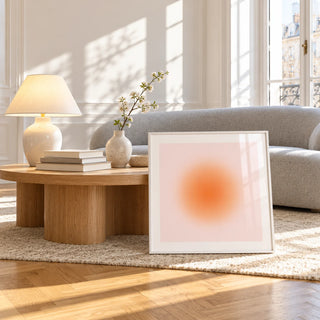 Apricot Print, framed and leaning against a coffee table in a bright living room
