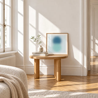 Aqua Print, a small square framed print leaning on a small solid oak side table