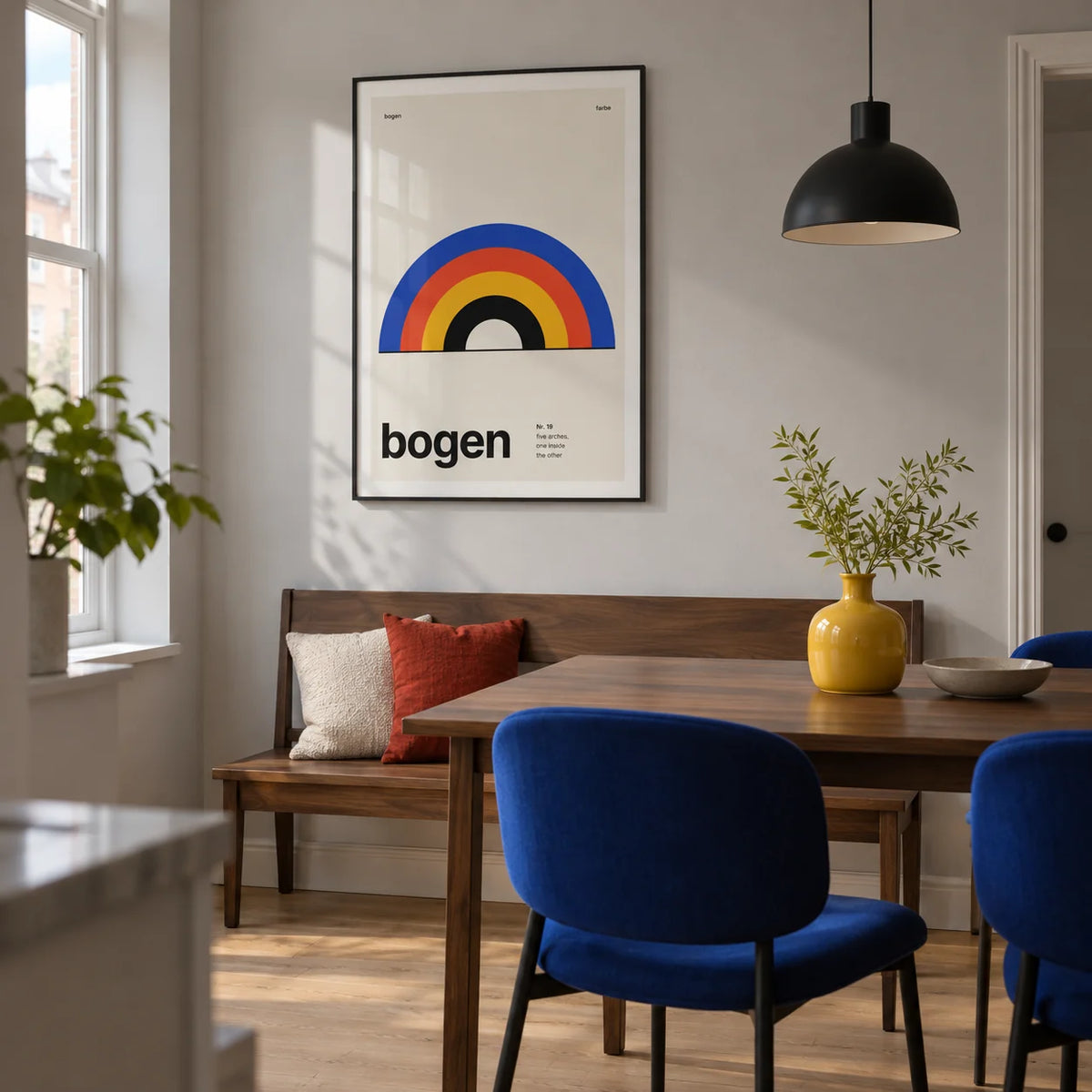 Arch Print, framed on the wall of a compact modern dining room in a UK flat with pale grey walls and a light oak floor
