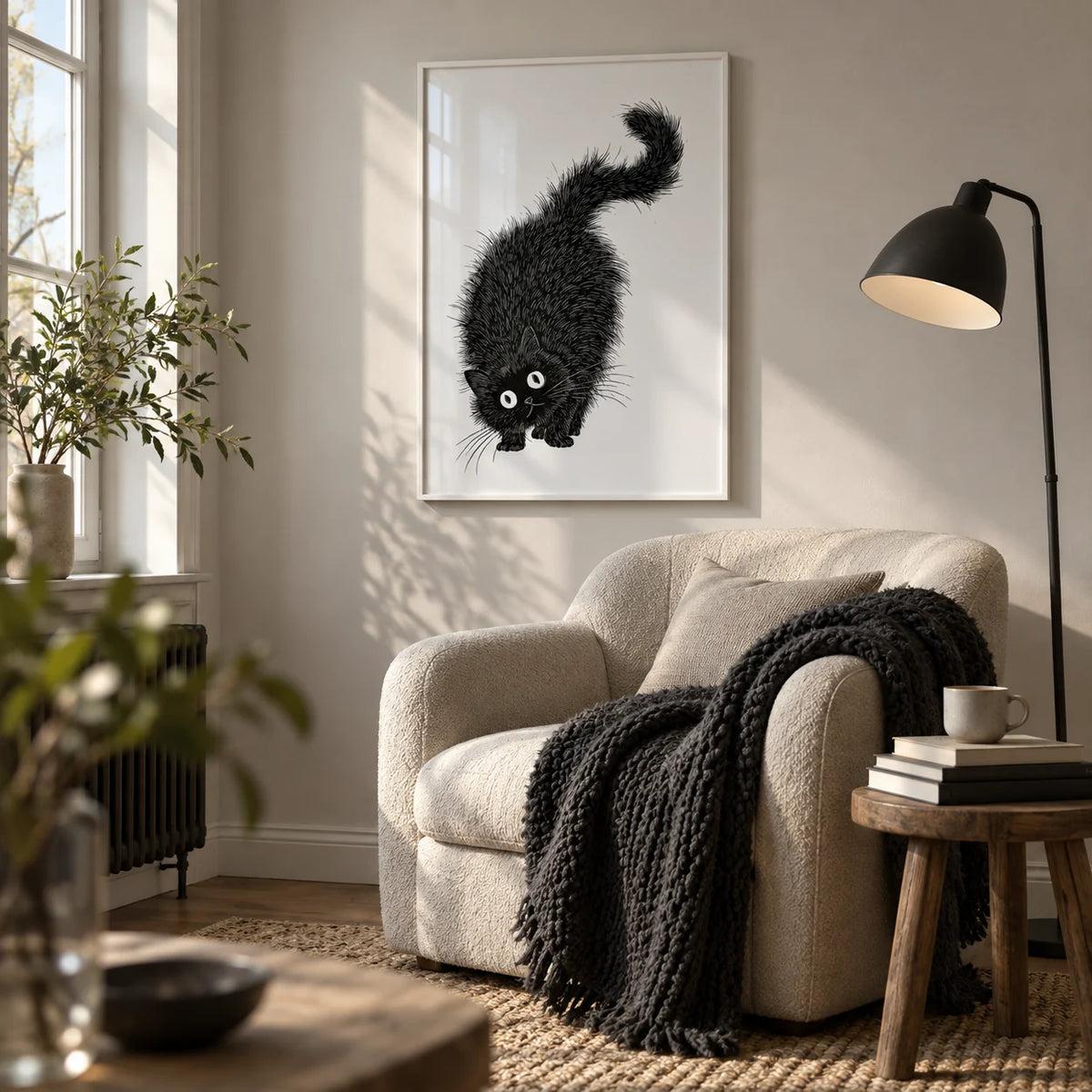 Arched Back Cat Print, framed on the wall of a reading nook by a window in a living room