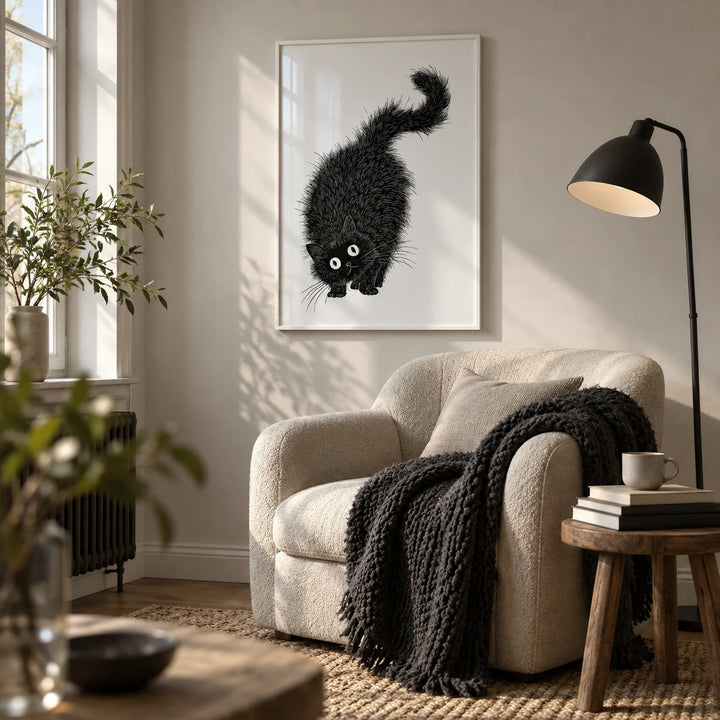 Arched Back Cat Print, framed on the wall of a reading nook by a window in a living room