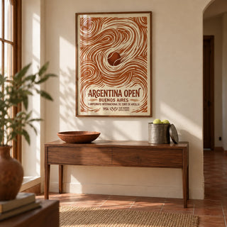 Argentina Open Poster, framed on the wall of a warm hallway with a pale cream wall and a plain terracotta floor