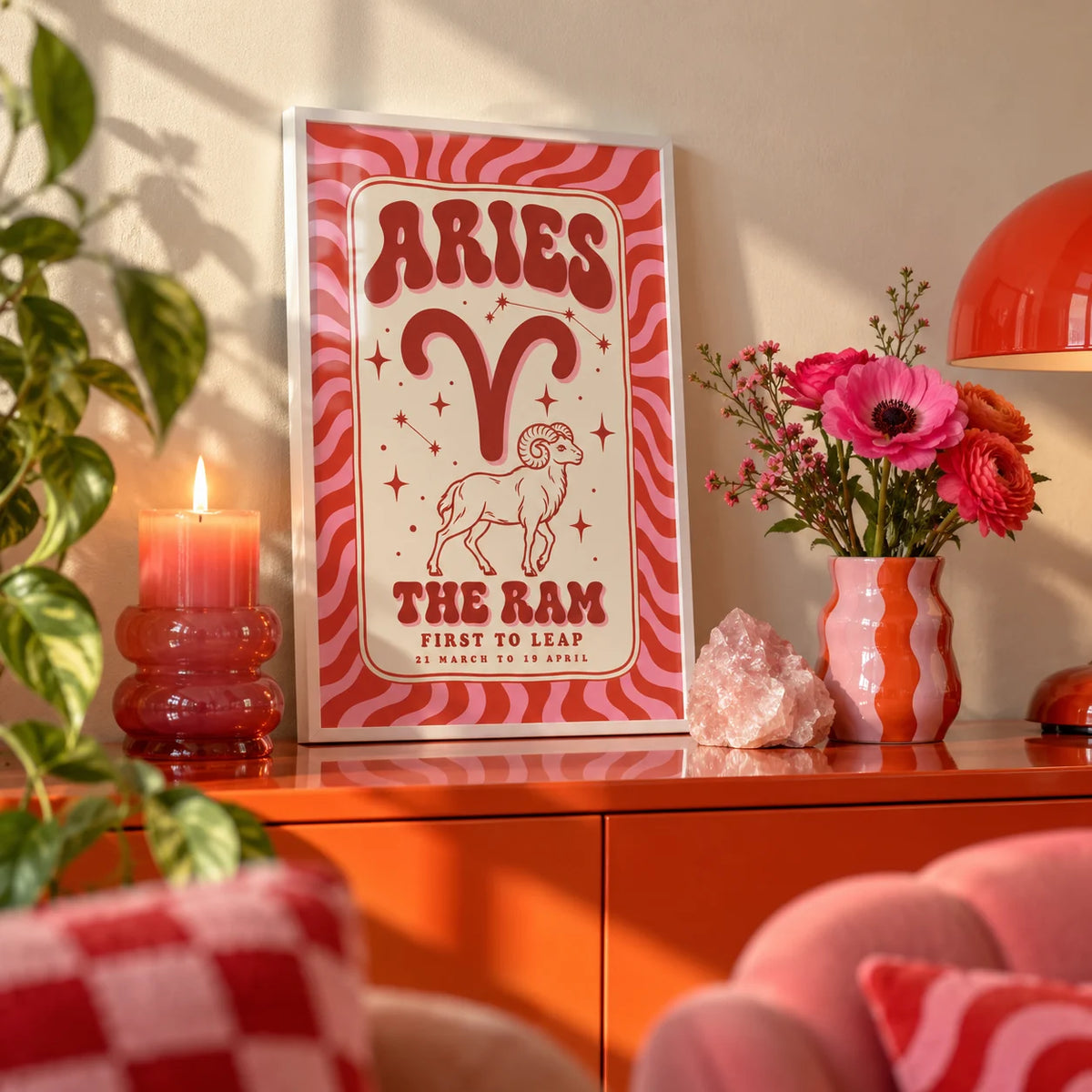 Aries Print, a small A4 framed print leaning on a colourful lacquered shelf in a living room