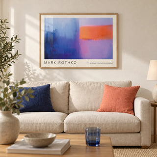Art by Mark Rothko, framed on the wall of a calm modern living room with a warm white wall