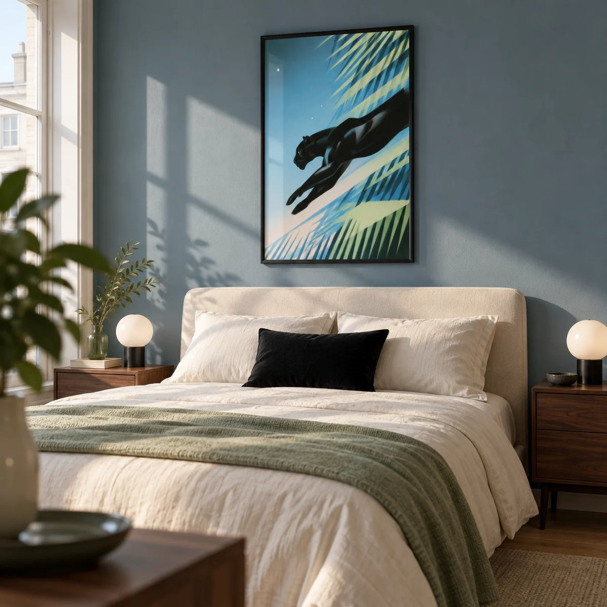 Art Deco Black Panther Print, framed on the wall of a grown-up bedroom in a UK flat with a muted blue wall and simple walnut bedside tables