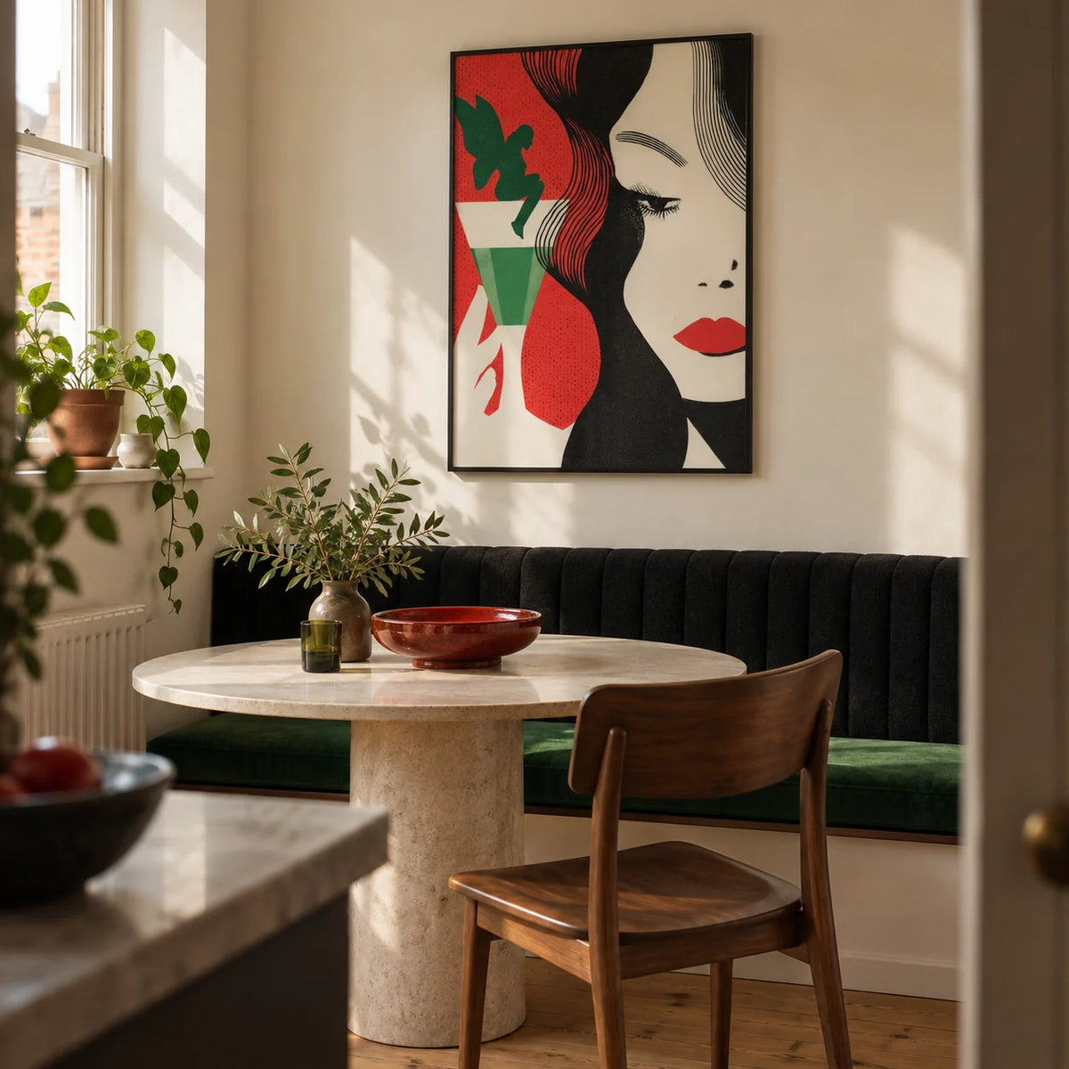 Art Deco Cocktail Woman Print, framed on the wall of a small dining alcove in a London maisonette with a warm cream wall and a built-in black upholstered banquette