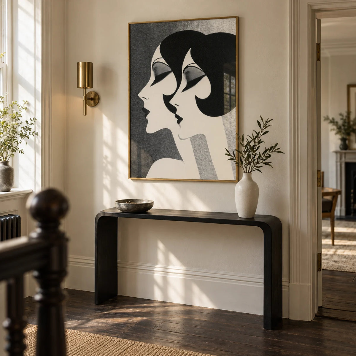 Art Deco Female Profiles Print, framed on the wall of a characterful hallway in a renovated British period flat with ivory walls and dark timber floorboards