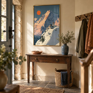 Art Deco Mountain Poster, framed on the wall of a characterful entrance hallway in a UK stone cottage with warm cream walls and a flagstone floor