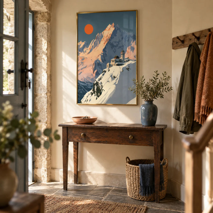 Art Deco Mountain Poster, framed on the wall of a characterful entrance hallway in a UK stone cottage with warm cream walls and a flagstone floor