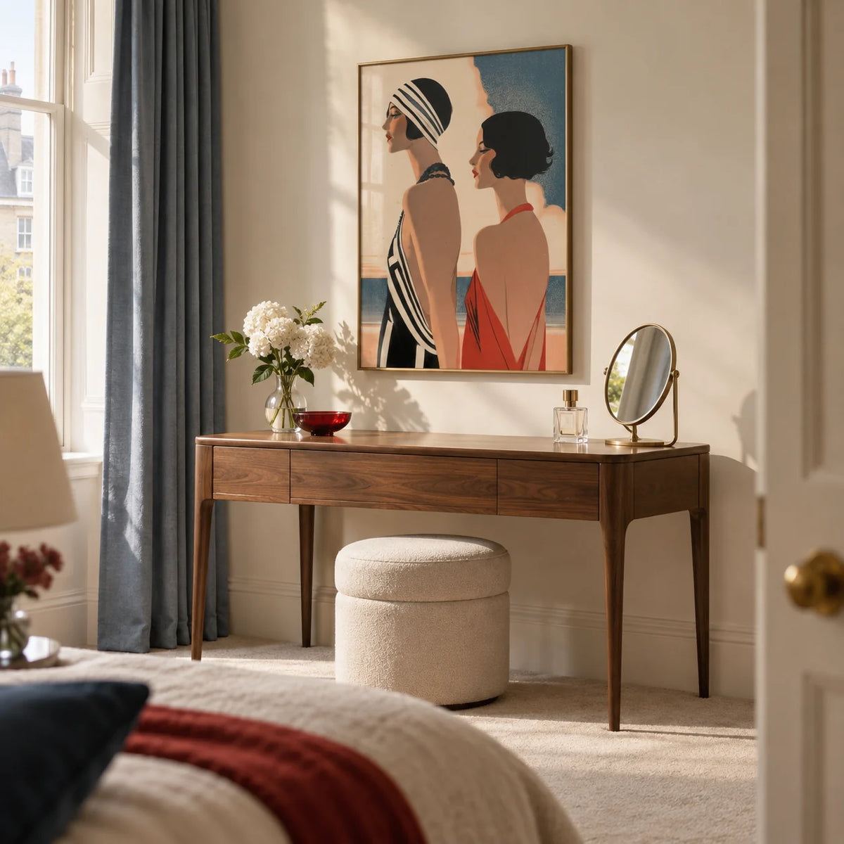 Art Deco Riviera Fashion Print, framed on the wall of a sophisticated bedroom dressing area in a UK mansion flat with cream walls and a plain wool carpet