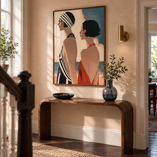 Art Deco Riviera Fashion Print, framed on the wall of a welcoming hallway in a renovated British terrace with pale peach plaster walls and dark timber floorboards