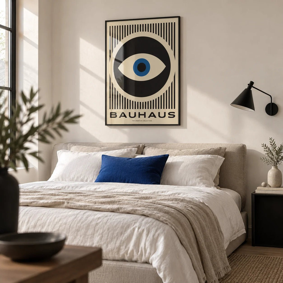 Art Modern Prints, framed on the wall of a crisp monochrome bedroom