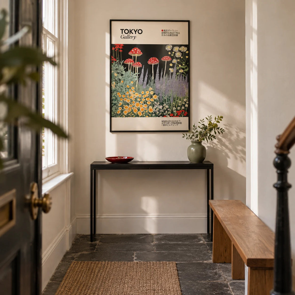 Art Prints Japanese, framed on the wall of a narrow entrance hallway in a London terrace with cream plaster walls and a plain dark stone floor