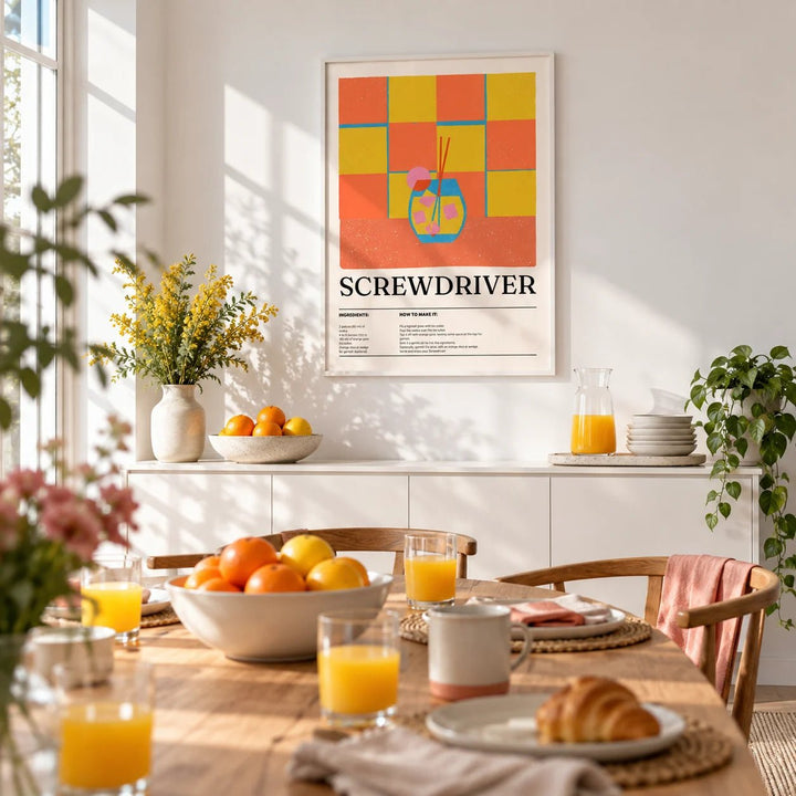 Art Prints Kitchen, framed on the wall of a bright dining room set for brunch with a white wall